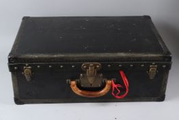LOUIS VUITTON, A LARGE SUITCASE WITH BLACK LEATHERCLOTH COVERING, brass locks and black japanned