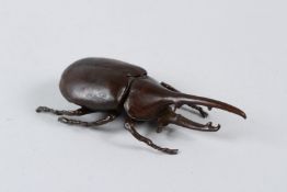 A JAPANESE ARTICULATED OKIMONO RHINO BEETLE. 11cms.