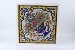 A 19TH CENTURY PANEL OF CUERDA SECA POTTERY TILES, QAJAR IRAN. 50cms x 50cms.