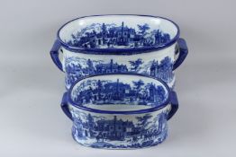 TWO REPRODUCTION BLUE AND WHITE PORCELAIN FOOTBATHS. 43cms and 31cms long.