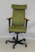 A MODERN OFFICE SWIVEL ARMCHAIR, upholstered in a green suede fabric. 115cms high.
