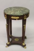 A FRENCH EMPIRE STYLE MAHOGANY, MARBLE AND ORMOLU MOUNTED CIRCULAR OCCASIONAL TABLE. 79cms high x