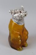 A AMBER COLOURED GLASS BEAR CLARET JUG with plated mounts. 22cms high.
