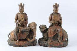 A PAIR OF LACQUER WOOD FIGURES OF SIMHANADA AVALOKITESVARA, late Ming / Qing Dynasty, one modelled