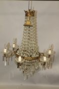 A GOOD PAIR OF ORMOLU CHANDELIERS, each with six scrolling branches with cut glass pans and prism