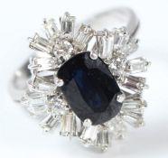 A WHITE GOLD, DIAMOND AND SAPPHIRE CLUSTER RING.
