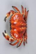AN UNUSUAL PAINTED CAST IRON CRAB SHAPED BOX, with hinged cover. 32cms wide.