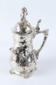 IN THE MANNER OF WMF, A PLATED STEIN WITH FIGURAL DECORATION. 42cms high.