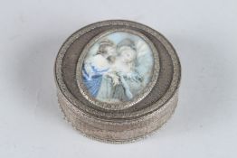 A GOOD 18TH CENTURY FRENCH SILVER CIRCULAR BOX AND COVER, the lid with an ivory panel painted with