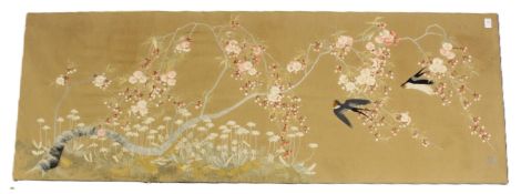 A LARGE JAPANESE EMBROIDERED PICTURE, depicting a pair of swallows flying amongst cherry blossom,