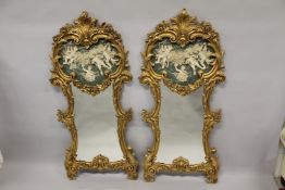 A PAIR OF ORNATE GILT COMPOSITE FRAMED PIER MIRRORS, with decorative classical style faux marble