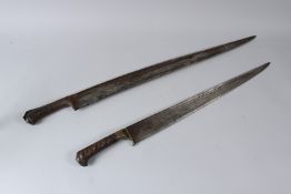 TWO LARGE 19TH CENTURY AFGHAN KHAYBAR KNIVES. 64cms and 75cms long.