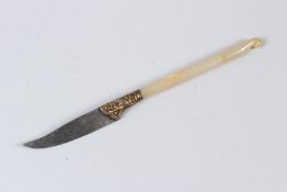 A SMALL PERSIAN KNIFE, with slender agate handle, gilt decorated hilt, plain curving blade. 22cms