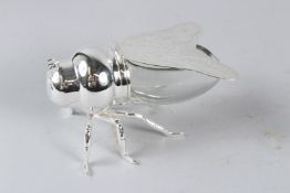 A SILVER PLATED AND GLASS BEE SHAPE PRESERVE POT. 16cms long.