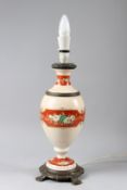 A PORCELAIN AND ORMOLU VASE SHAPED TABLE LAMP, with bands of floral decoration. 40cms high.