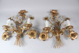 A PAIR OF NATURALISTIC FORM ORMOLU AND CUT GLASS TWIN-BRANCH WALL APPLIQUES. 54cms high x 48cms