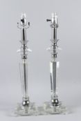 A PAIR OF STYLISH ART DECO STYLE CUT GLASS TABLE LAMPS. 53cms high.