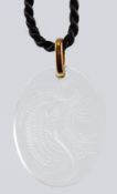 A LALIQUE INTAGLIO ENGRAVED OVAL PENDANT, suspended on a cord, boxed..