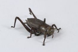 A JAPANESE OKIMONO BRONZE CRICKET. 9cms.