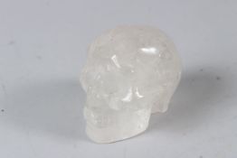 A SMALL CARVED ROCK CRYSTAL SKULL. 7cms long.