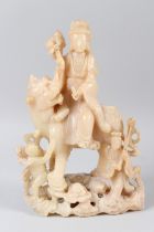 A LARGE CHINESE CARVED SOAPSTONE GROUP, 19TH/20TH CENTURY, modelled as Guanyin seated on the back of
