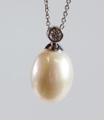 AN 18CT WHITE GOLD, DIAMOND AND PEARL PENDANT AND CHAIN.