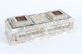 A 19TH CENTURY HOLY LAND JERUSALEM MOTHER-OF-PEARL CLAD WOODEN INKWELL STAND. 26cms high.