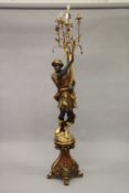 AN ORNATE BLACKAMOOR FIGURAL FLOOR STANDING FIVE LIGHT CANDELABRA, on a pedestal base. 215cms high.