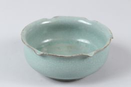 A PETAL SHAPE RU WARE BOWL. 15cms diameter.