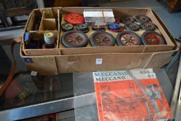 A box containing a large quantity of Meccano items.