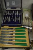 A cased set of butter knives, a cased set of cake forks and a set of six plated fish knives.