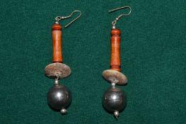 A pair of decorative earrings.