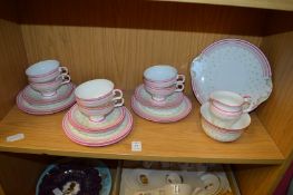 A Royal Doulton six place tea service with green polka dot and pink striped design.