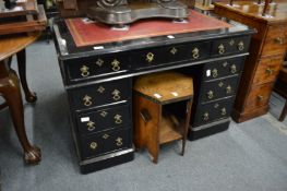 A Victorian ebonised pedestal desk.