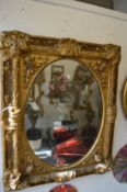 A large and impressive gilt framed mirror.