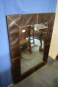 Modern rectangular wall mirror with brown leather cloth frame.