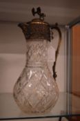 Cut glass claret jug with plated mounts.