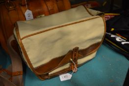 A canvas and leather shoulder bag.