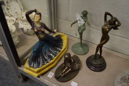A group of Art Deco style figures.