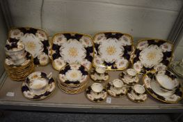 A quantity of Coalport cups, saucers and serving dishes with gilt and floral decoration.