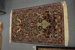 A small Persian silk tree of life rug, 125cm x 78cm.