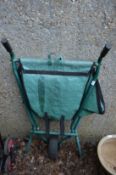 A collapsible wheel barrow.