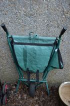A collapsible wheel barrow.