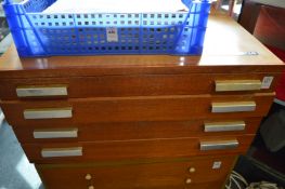 A Meccano outfit No 10 four drawer teak chest containing numerous Meccano items.