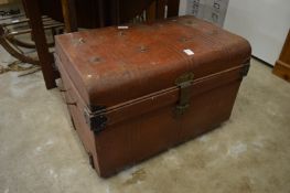 A tin trunk containing brass watering cans and other collectables.