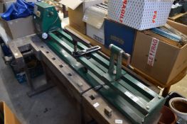 A wood turning lathe with turning chisels.