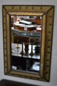 A decorative small mirror.