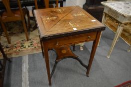 A Victorian inlaid rosewood envelope card table.