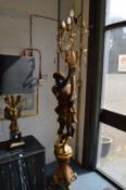 A floor standing Blackamoor candelabra.