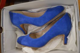 A pair of Clarkes ladies blue suede shoes, size 6.